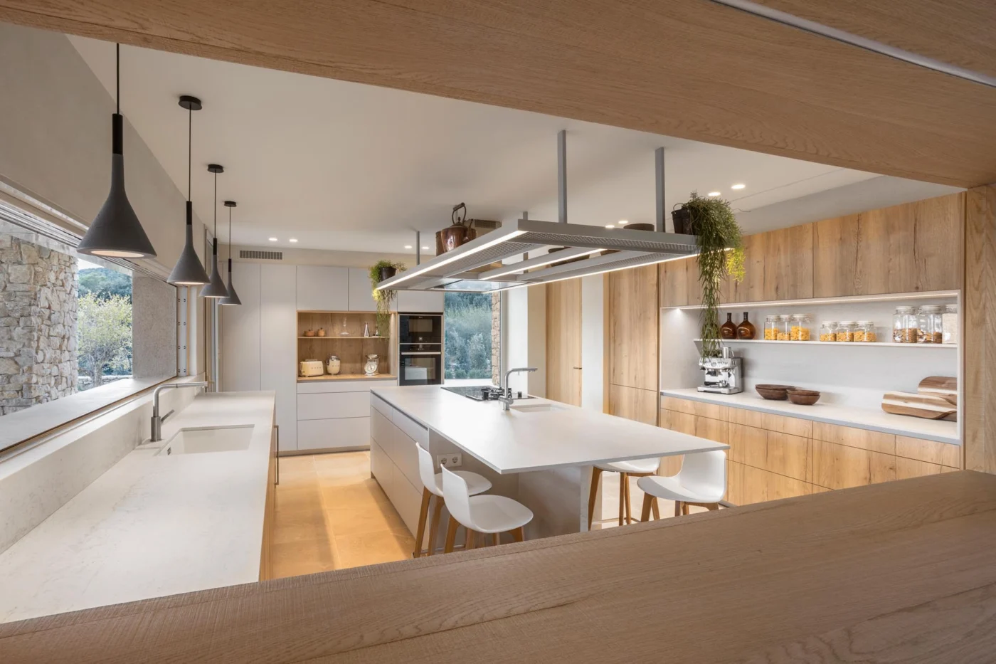 Kitchen with white counters, wood cabinetry and a central island